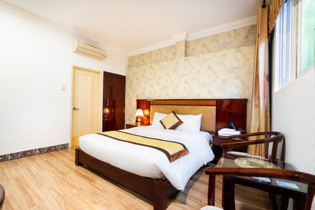Cosmo Central Hotel Ho Chi Minh Buitenkant foto